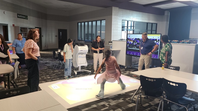 Students use the interactive floor to learn about 8th grade Science