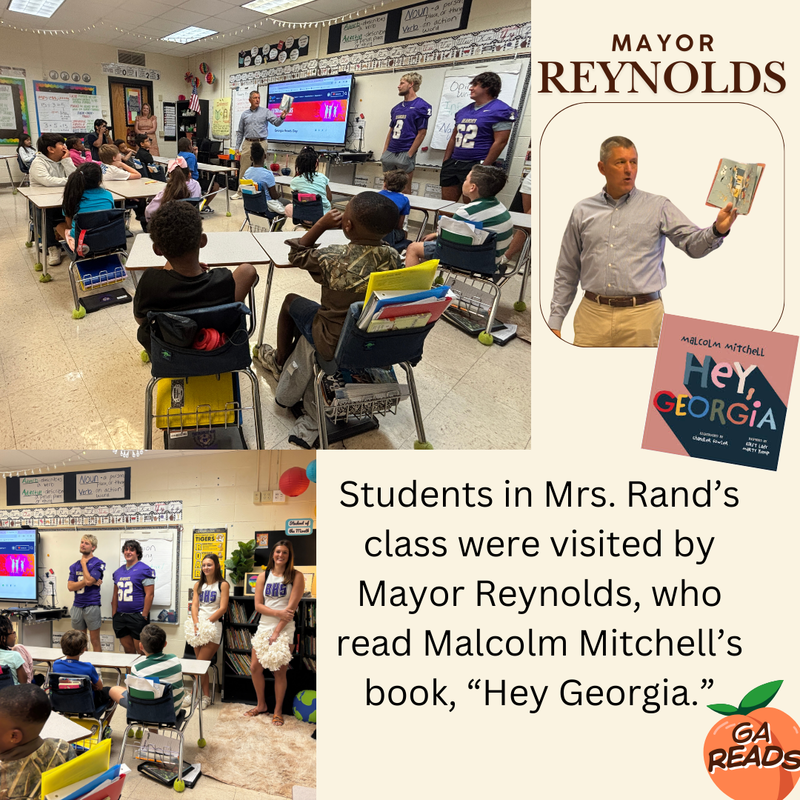 This image contains a picture of Mayor Reynolds reading to a class of students along with some of the Bearcat football players and cheerleaders.