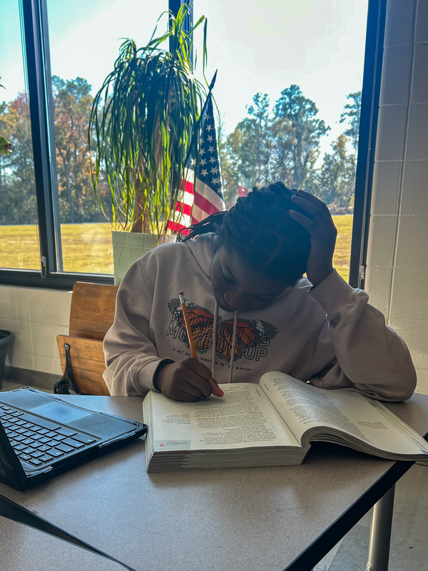 Student working in ELA book.