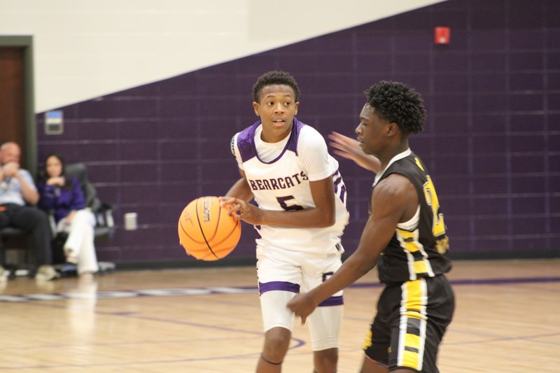 Student dribbling a basketball