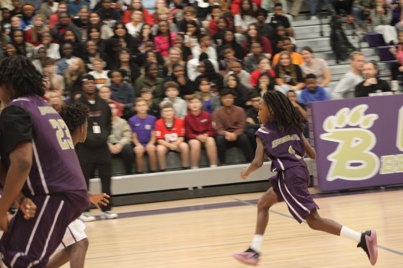 Student running the basketball