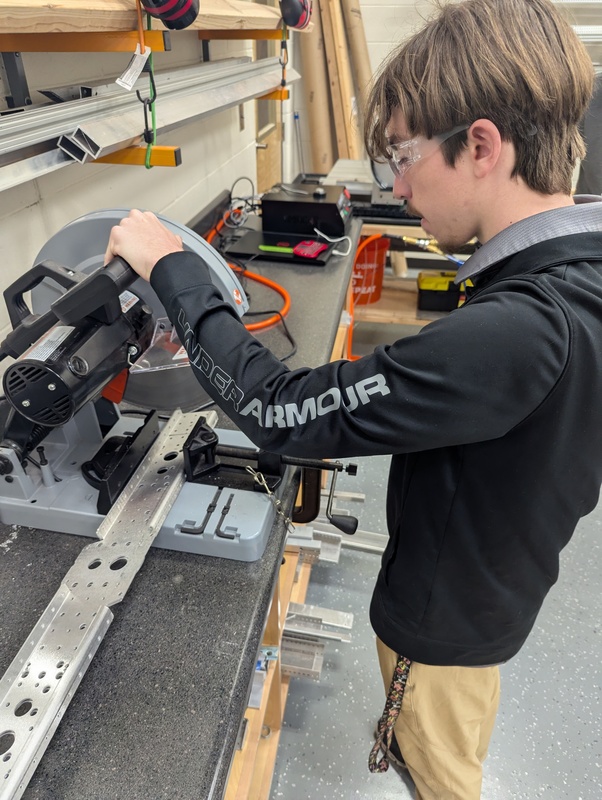 Cutting the rails to create the base of our robot