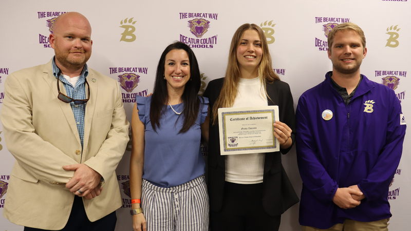 Student recognized by the Decatur County Schools Board of Education for athletic achievement during a board meeting