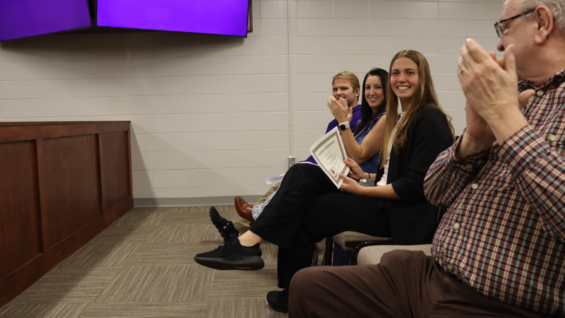 Student recognized by the Decatur County Schools Board of Education for athletic achievement during a board meeting