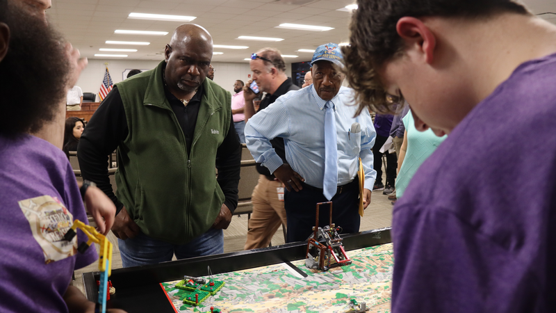 Bainbridge Middle School educators present and recognize the robotics teams at the board meeting.