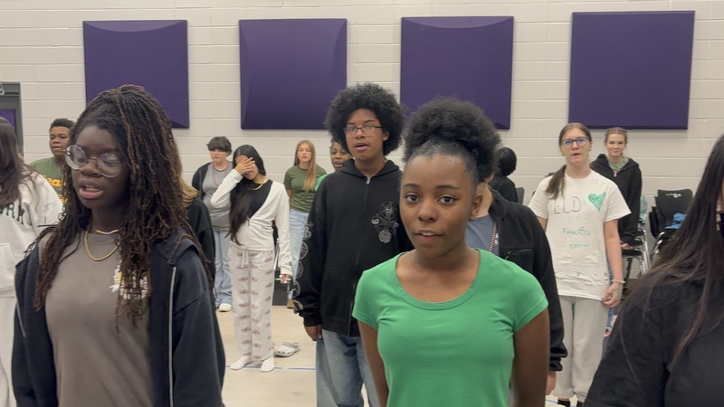 Students practicing for a chorus performance