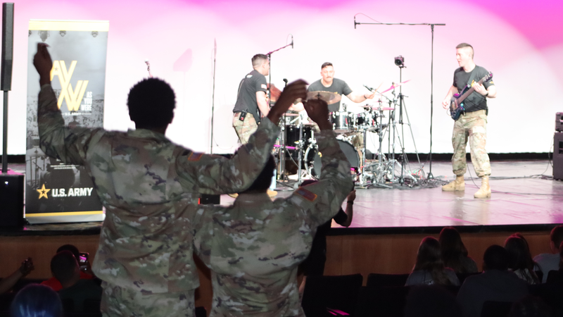 Audience members cheer as the U.S. Army Field Band’s “As You Were” performs on stage at the Performing Arts Center.
