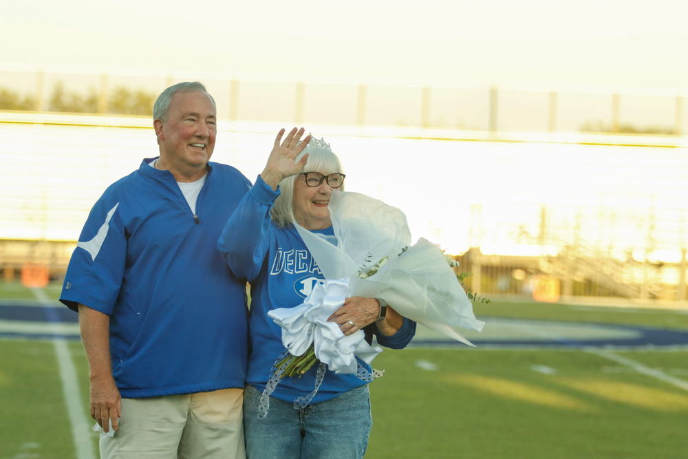 Photos of Ronnie Gage and Stephanie Gage at the 2025 homecoming game
