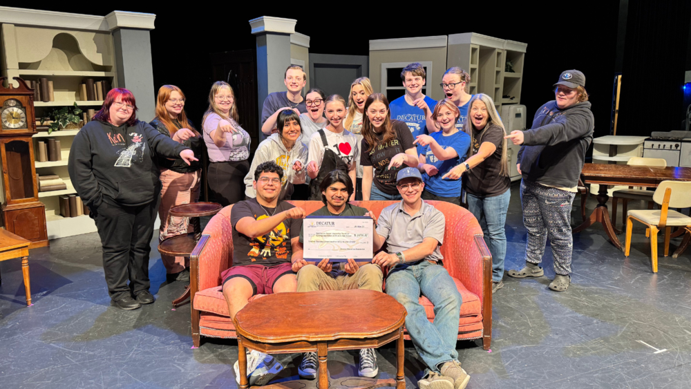 Photo of theatre students being surprised with a D-E-F grant