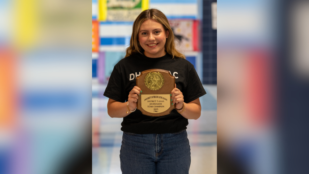 Emma Crabtree pictured with her award