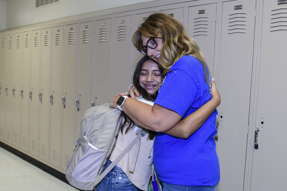 Photo of a teacher giving a student a hug at McCarroll Middle School