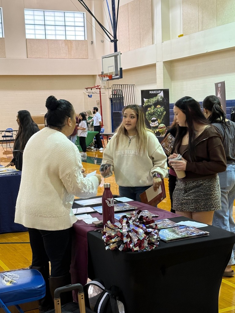 Students visiting recruiters at college fair