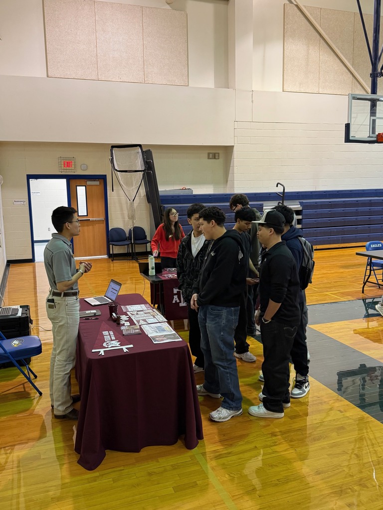 Students visiting recruiters at college fair