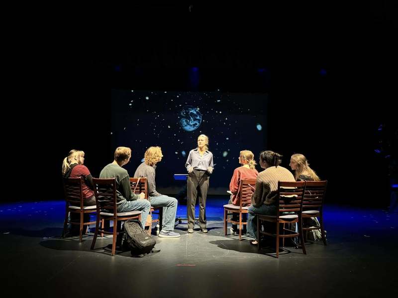 Theatre students under a spotlight