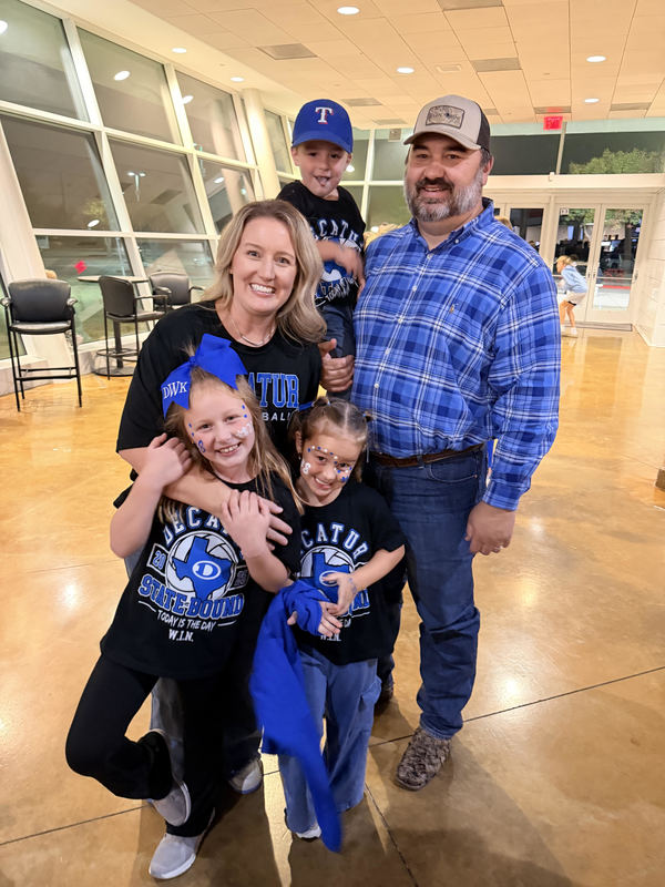 Photo of the Williams family, including their three children