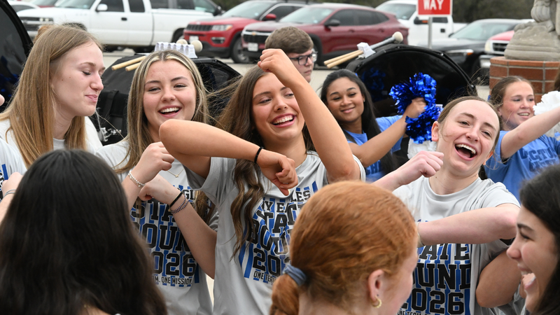 The team celebrates, cheers, and dances during their state sendoff