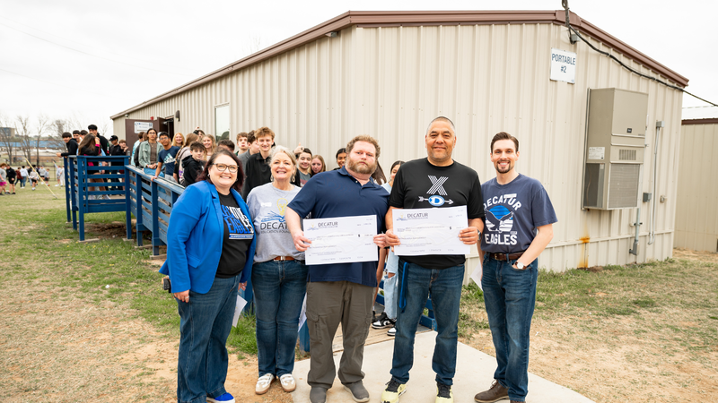 Photo of grant winners at McCarroll Middle School by the portable buildings 