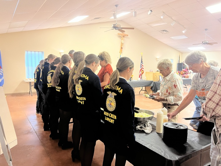 Officers serving the meal.