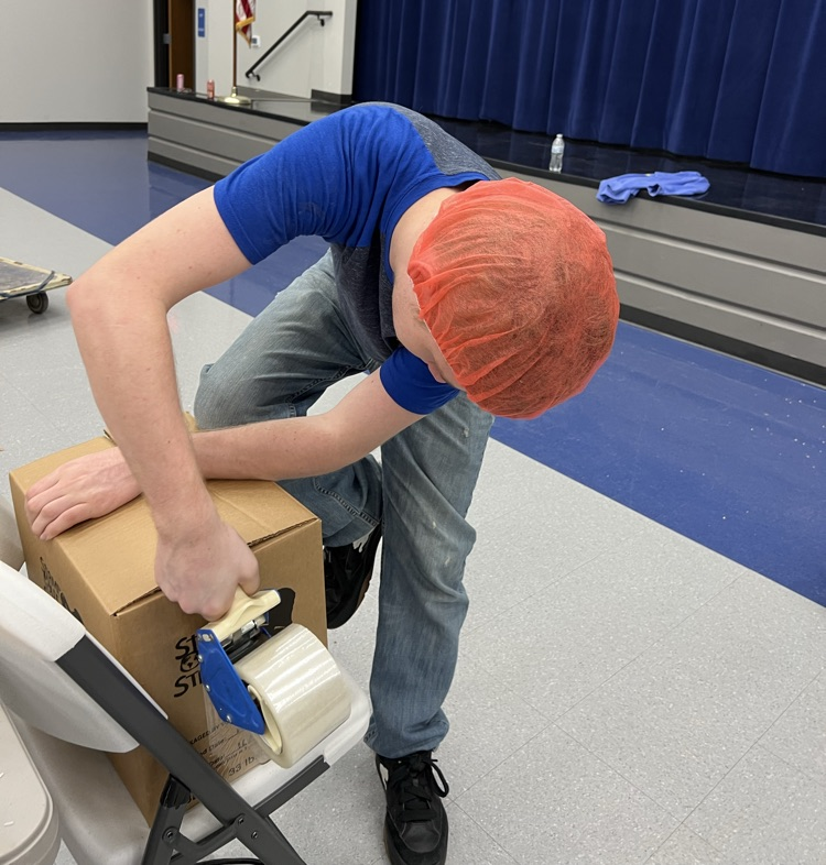 Kyler was efficient taping the boxes!!