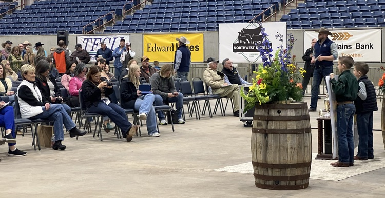 Derby taking pictures of members in the sale!