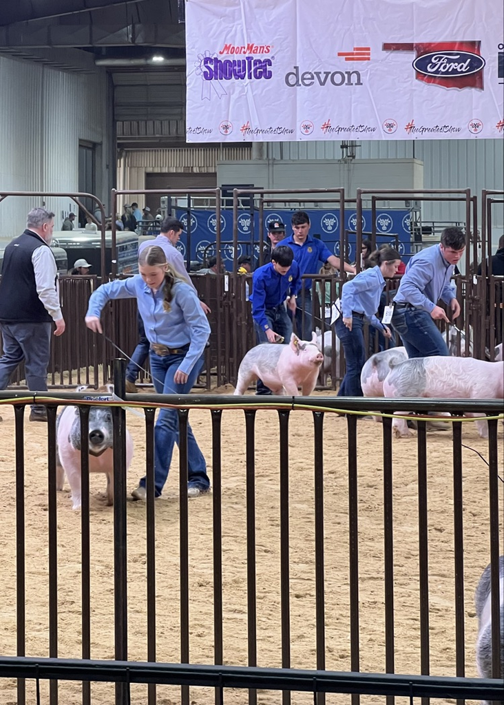 Showing his 5th place light cross. 