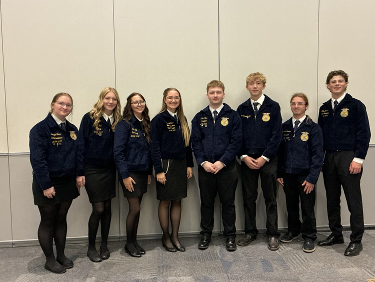 Officers with the state officers that led their small group at COLT Conference today. Colby and Sloane.