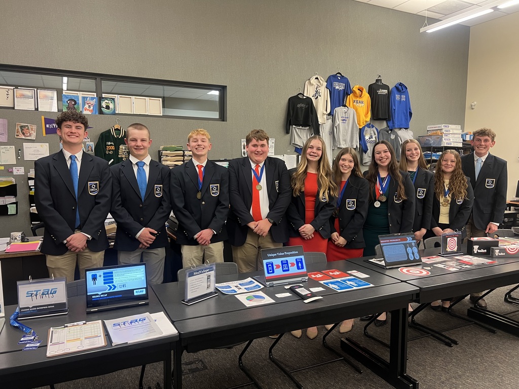 Photos of our Deca Students - Posing at one of their student stores