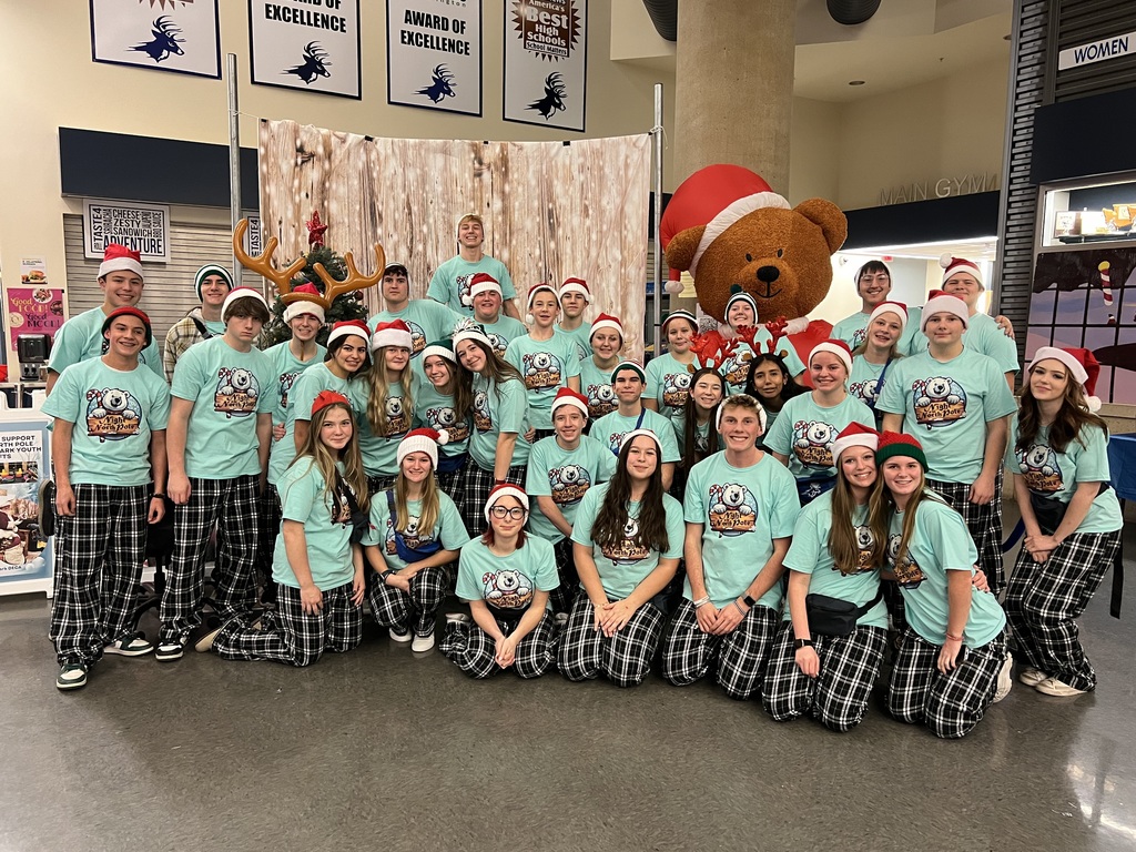 Photos of our Deca Students - Posing at Christmas event they put on, they all have santa hats