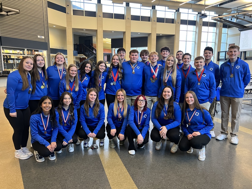 Photos of our Deca Students - Posing with medals from qualifying for state