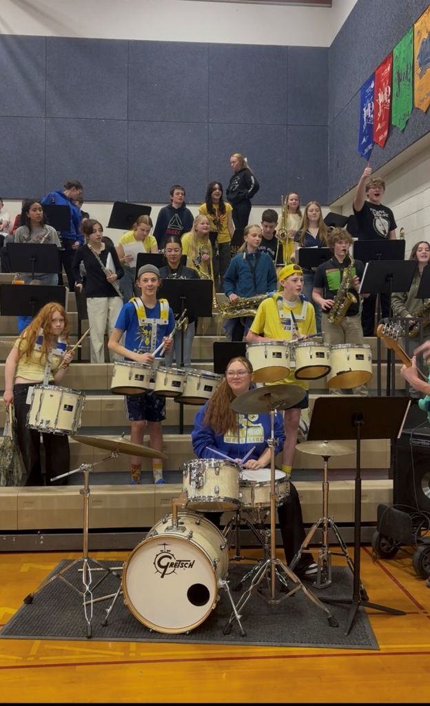 Middle school band during staff vs. student basket ball game