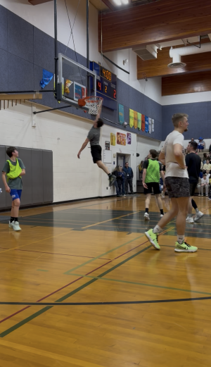 Middle School Staff shooting during staff vs. student basketball game