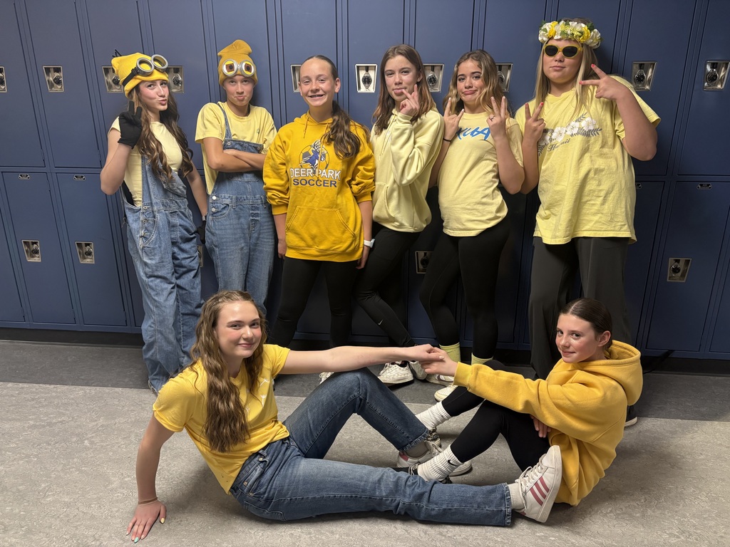 Middle School students posing for spirit day - yellow