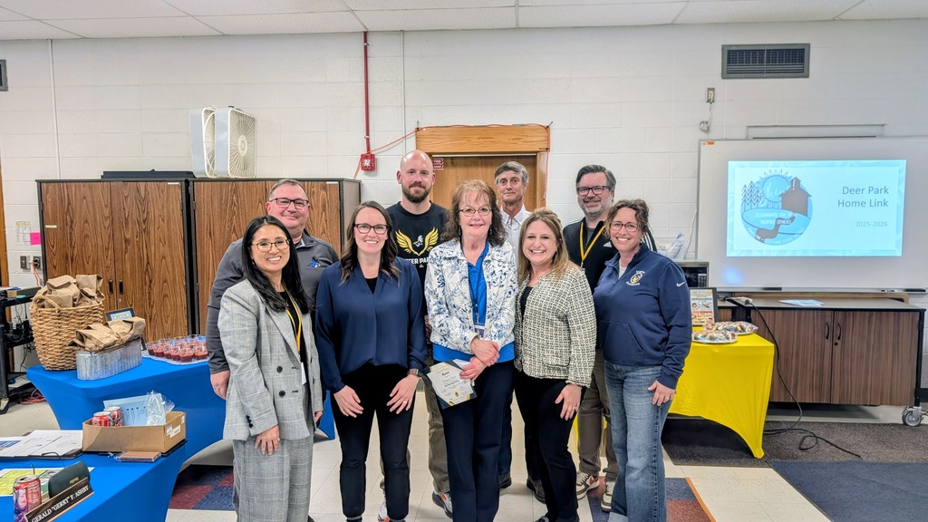 Picture of board with Pam Foster who received a Above and Beyond award