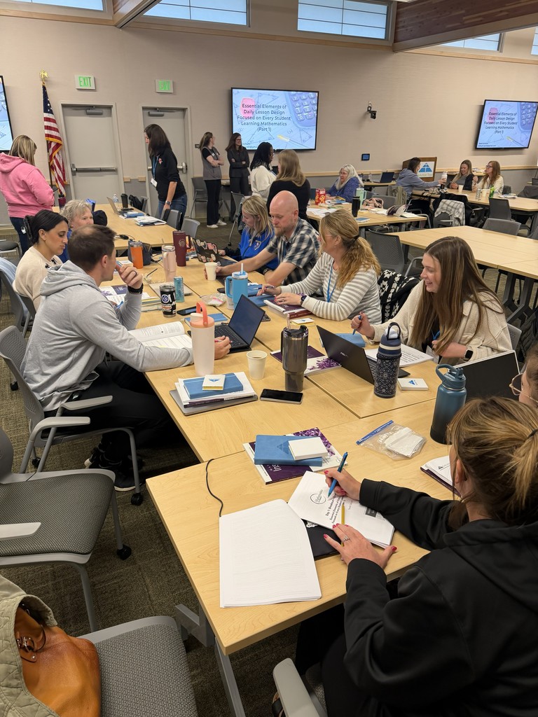 Math teachers working and learning ways to inform interventions.