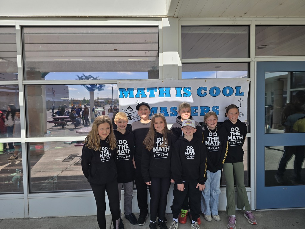 Students in front of Math is Cool banner