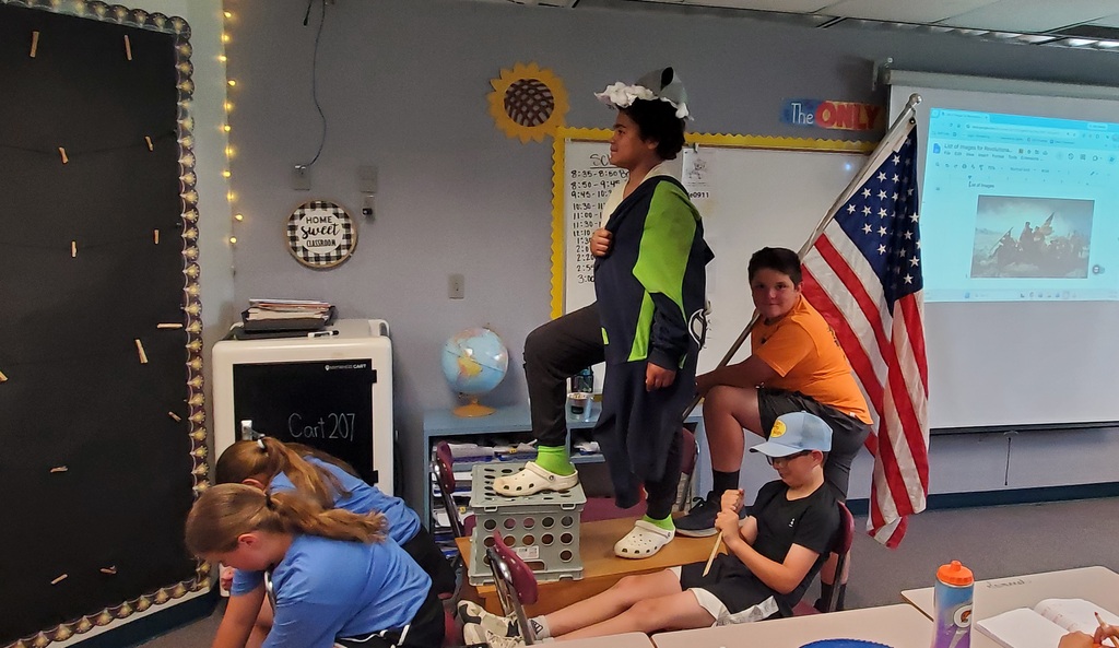Students reenacting revolutionary war paintings