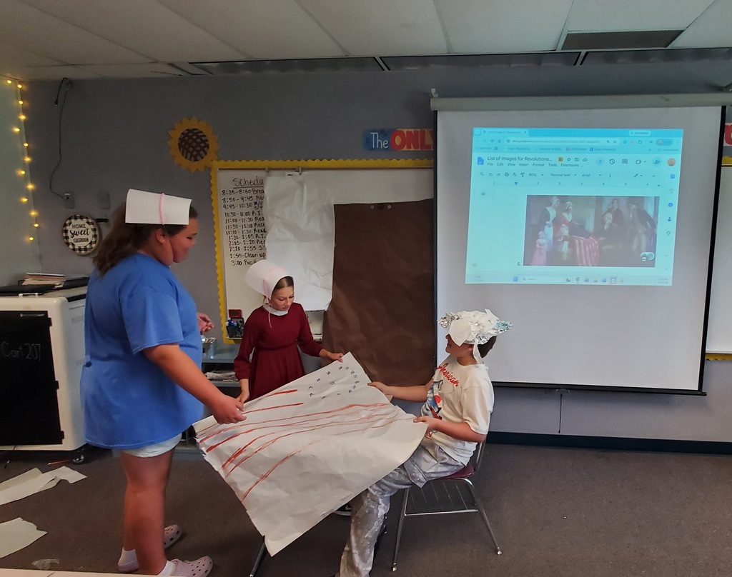 Students reenacting revolutionary war paintings