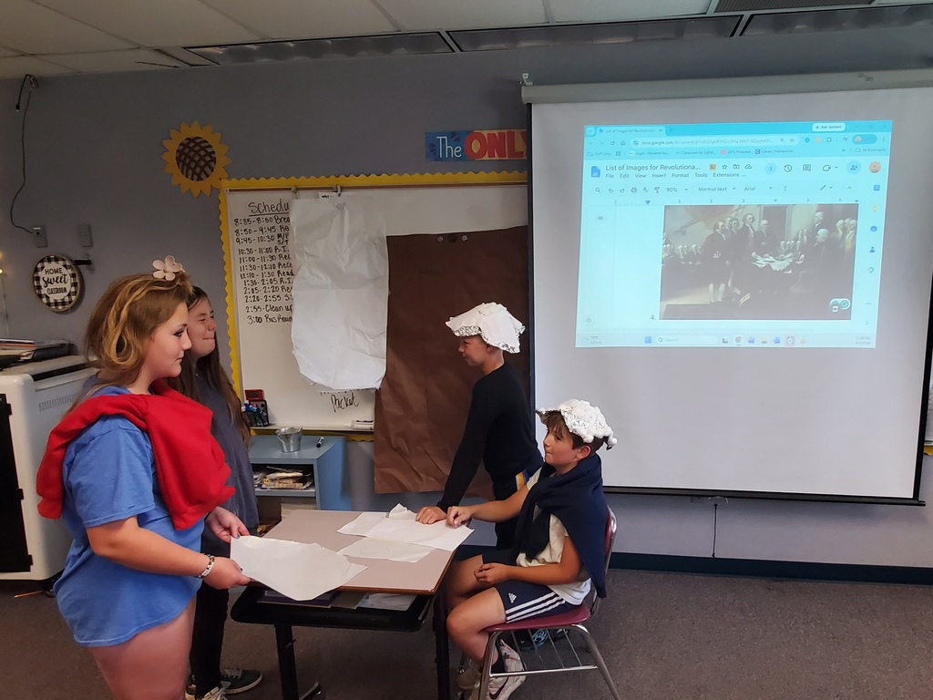 Students reenacting revolutionary war paintings