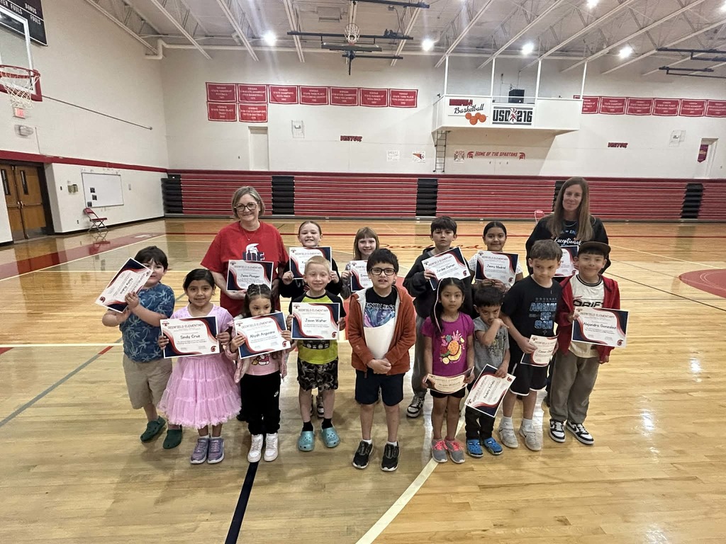 Elementary students with certificate in gym