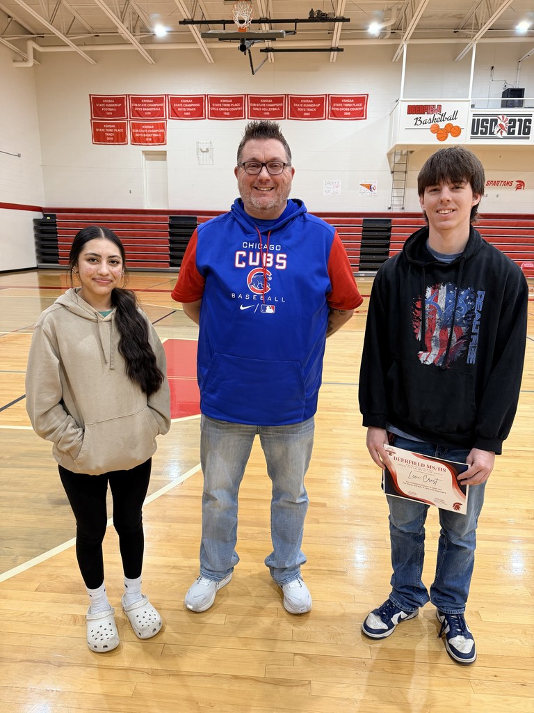 Principal with MS and HS students getting award in gym