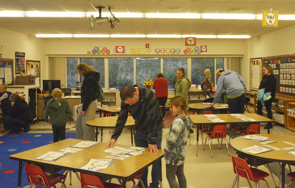 adults and children in a classroom