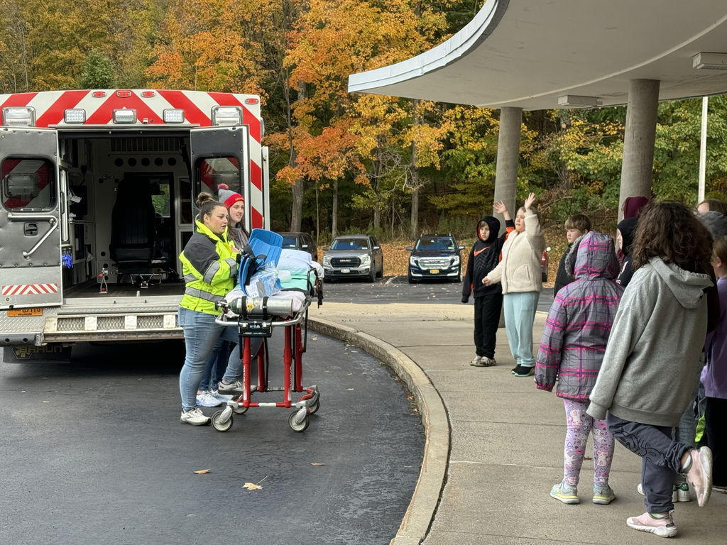 rescue squad members speak to children