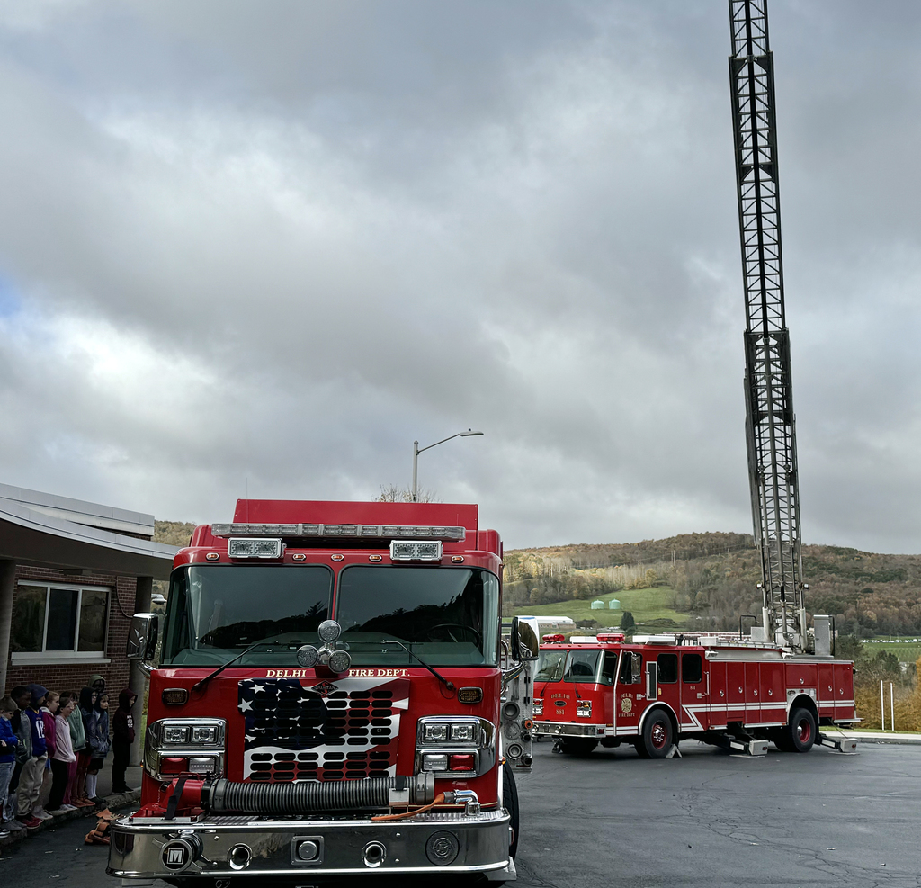 two fire trucks in front of elementary school