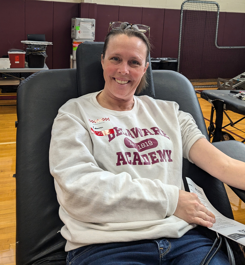 adult smiling as she gives blood