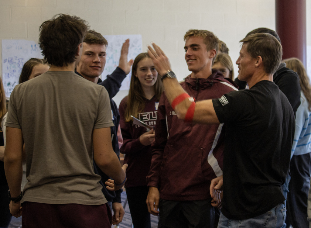 students and teacher high five