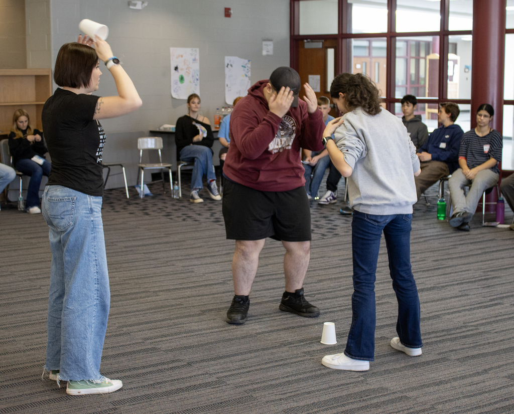 2 students and an adult doing an exercise