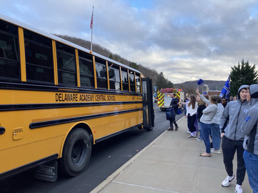 coach Comer gets on school bus