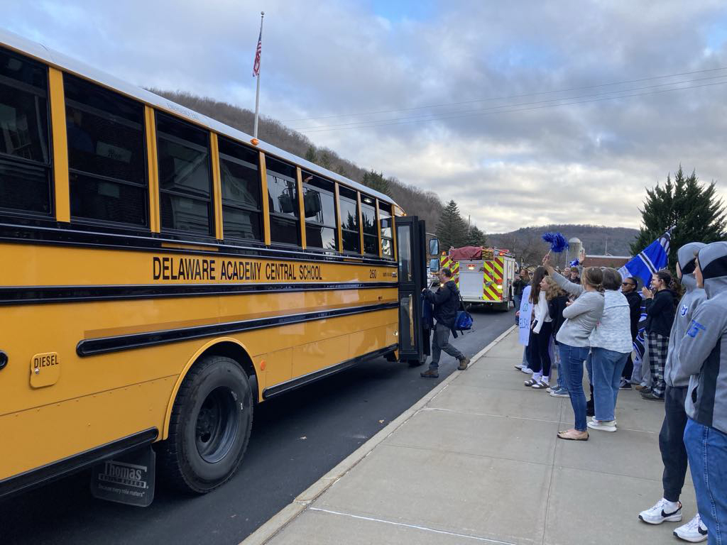coach Comer gets on school bus