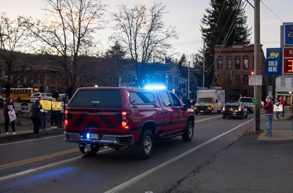 people cheer the fire truck