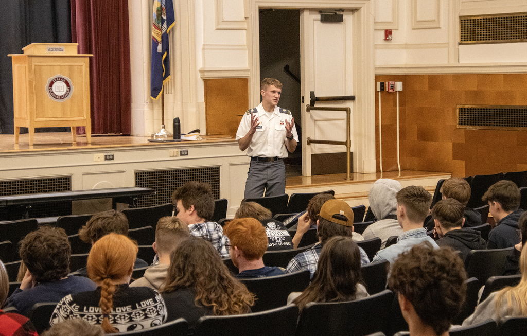 West Point cadet gestures while speaking to students